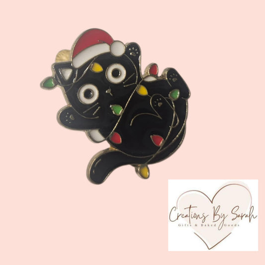 cute cat wrapped in xmas lights pin badge